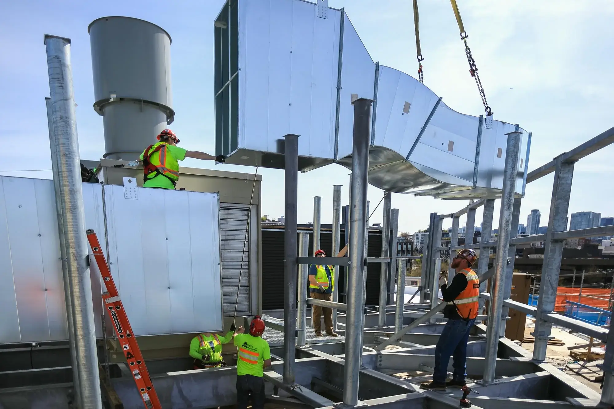Auburn Mechanical workers installing HVAC system