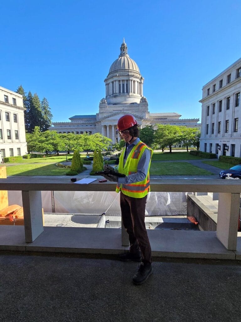 Auburn Mechanical employee in front of capital building
