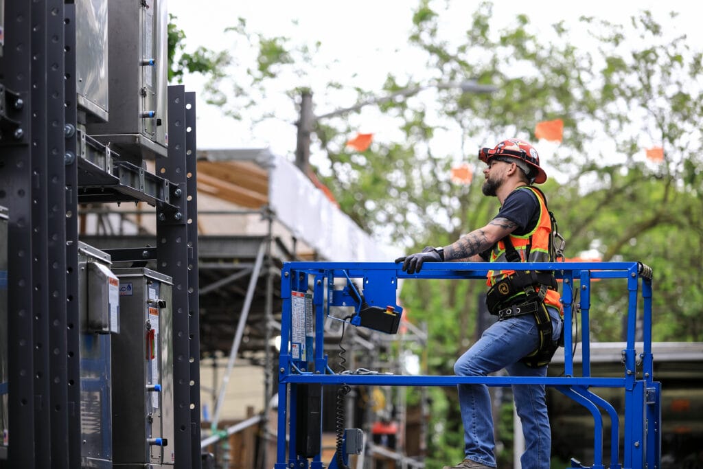 Auburn Mechanical employee on scissor lift