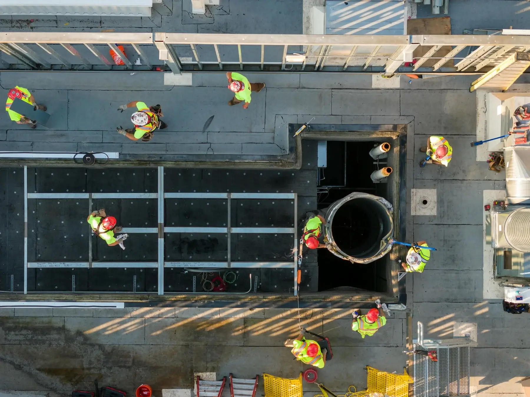 Rooftop arial view of jobsite and workers