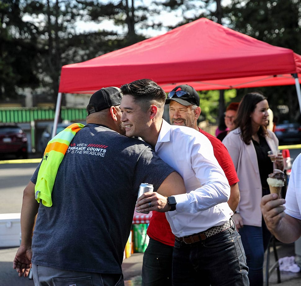Auburn Mechanical employees embracing at company party